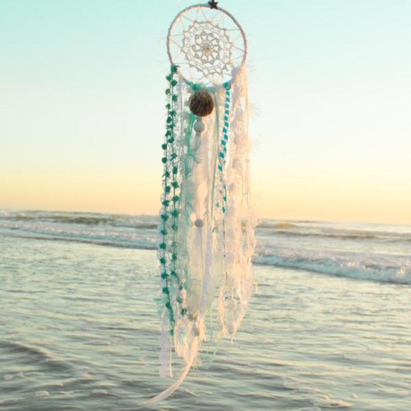 Handmade boho dream catcher by visionary artisan Kylee Joy in beautiful turquoise and white tones. 