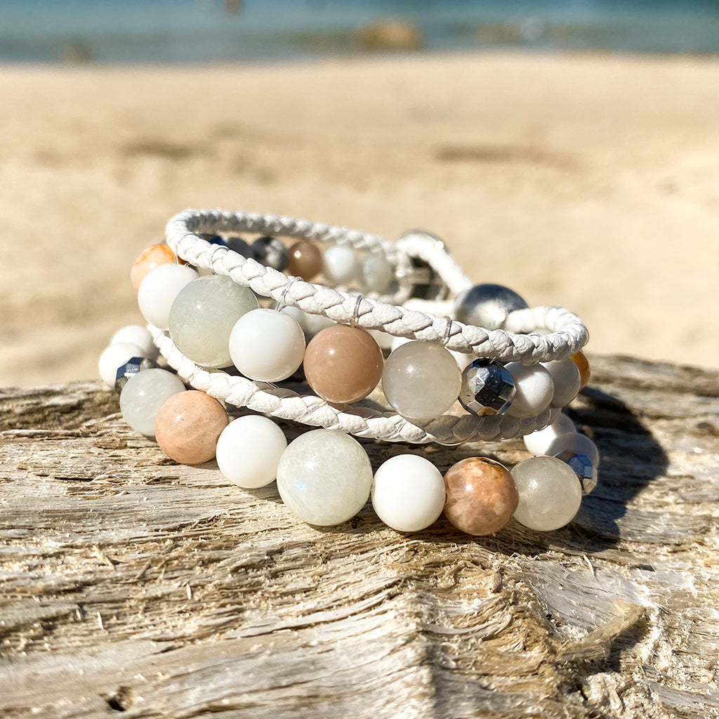 Artisan Crafted Natural Stone bracelet stack of two handmade in Byron Bay. Features natural White Alabaster, Howlite, natural sunstone, natural moonstone, freshwater pearl, Hematite, and Lava Stone beads.