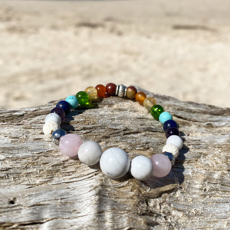 Artisan Crafted Natural Stone leather wrap bracelet handmade in Byron Bay. Features natural White Alabaster, Howlite, Rose Quartz, Amethyst, Peridot, Citrine, Carnelian, Red Coral, Hematite, and Lava Stone beads.