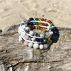 Artisan Crafted Natural Stone leather wrap bracelet handmade in Byron Bay. Features natural White Alabaster, Howlite, Rose Quartz, Amethyst, Peridot, Citrine, Carnelian, Red Coral, Hematite, and Lava Stone beads.