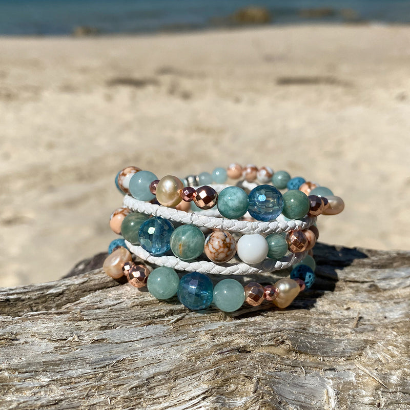 Stack of three artisan crafted natural crystal and lava stone beaded bracelet. Suitable for diffusing essential oils such as young living or Doterra. Handmade in Byron Bay. Great gift for  women. Features Ocean jasper & Amazonite crystals and freshwater pearls.