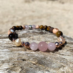Artisan Crafted Natural Stone essential oil bracelet, handmade in Byron Bay. Features natural Tiger Eye, Rose Quartz, Freshwater Pearl, Hematite, and Lava Stone beads.