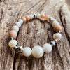 Artisan Crafted Natural Stone bracelet stack of two handmade in Byron Bay. Features natural White Alabaster, Howlite, natural sunstone, natural moonstone, freshwater pearl, Hematite, and Lava Stone beads.