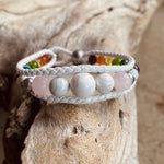 Artisan Crafted Natural Stone bracelet stack of three, handmade in Byron Bay. Features natural White Alabaster, Howlite, Rose Quartz, Amethyst, Peridot, Citrine, Carnelian, Red Coral, Hematite, and Lava Stone beads.