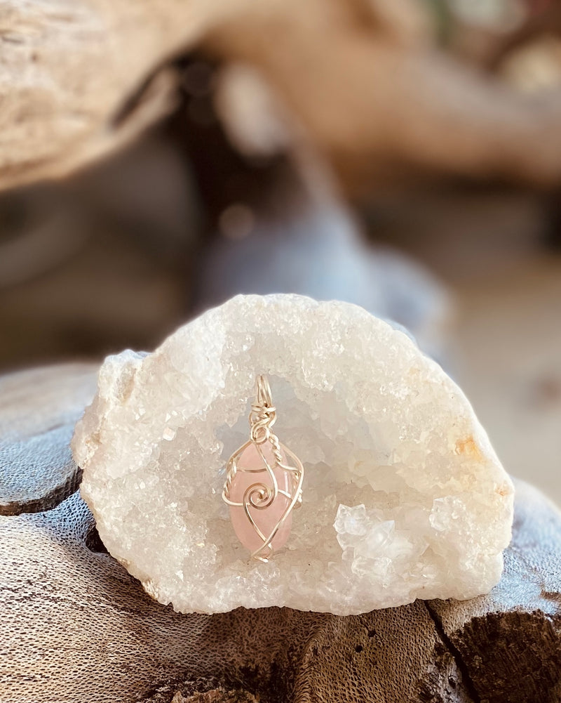 Artisan crafted natural Rose Quartz crystal pendant necklace, handmade in Byron Bay. Wrapped in fine silver-plated copper wire.