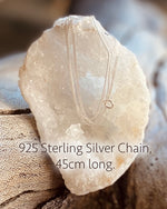 925 sterling silver small d-link chain, 45cm long. Draped over a sparkling white crystal cave.