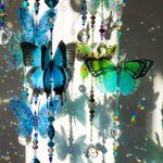 Hand made crystal suncatcher chandelier with an aqua, blue and green butterflies. Made in Byron Bay, Australia.