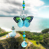 Hand made crystal suncatcher with an aqua and green butterfly motif. Made in Byron Bay, Australia.