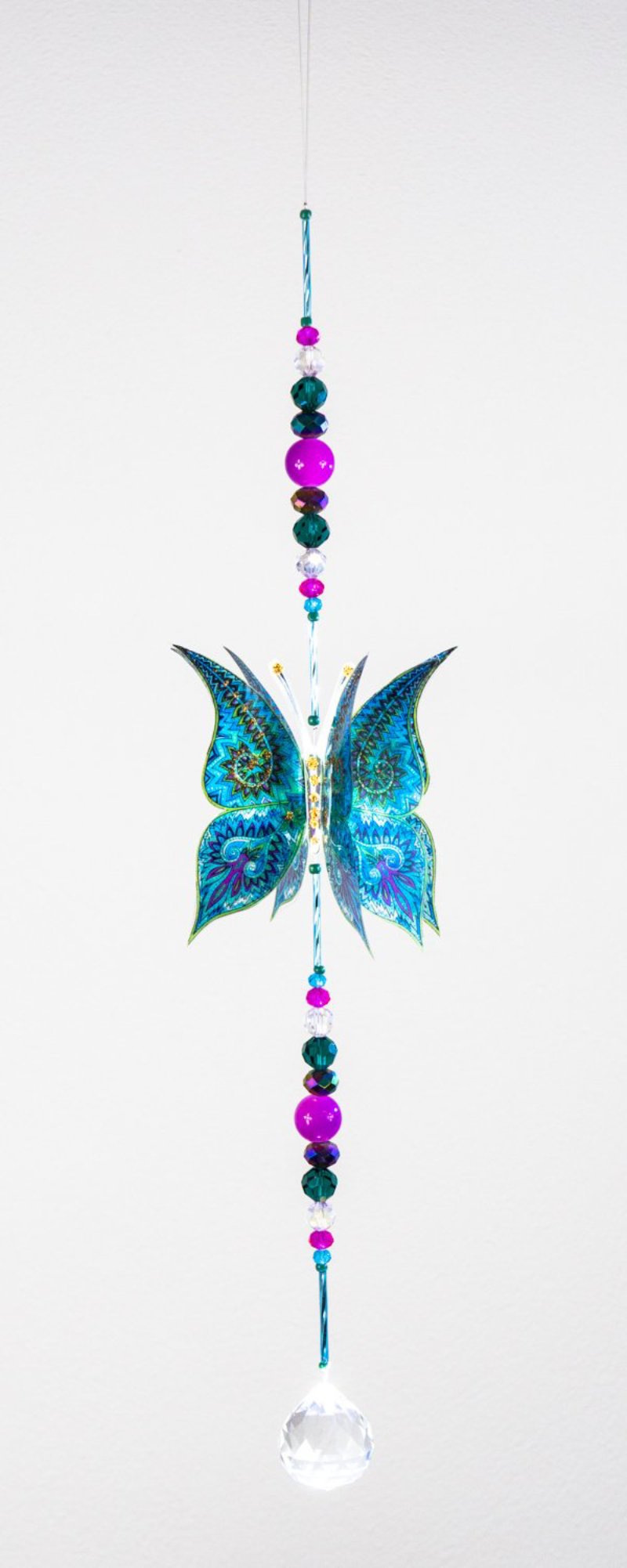 Hand made crystal suncatcher with an aquamarine butterfly motif. Made in Byron Bay, Australia.