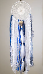 Handmade boho dream catcher by visionary artisan Kylee Joy in beautiful deep blue and white tones.
