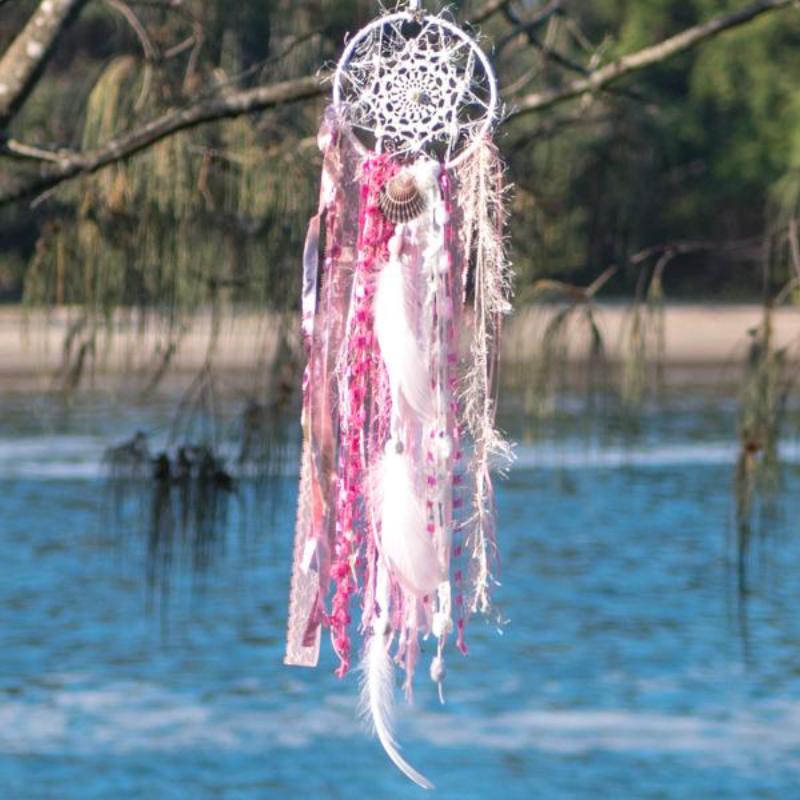 Handmade boho dream catcher by visionary artisan Kylee Joy in beautiful pink and white tones. 