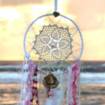 Handmade boho dream catcher by visionary artisan Kylee Joy in beautiful pink and white tones. 