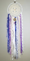 Handmade boho dream catcher by visionary artisan Kylee Joy in purple tones. 